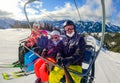 Family riding ski lift cable car on winter vacation skiing Royalty Free Stock Photo